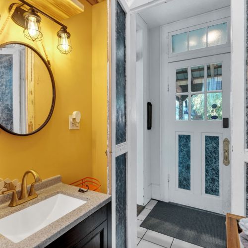 Bright bathroom with bold NOLA color