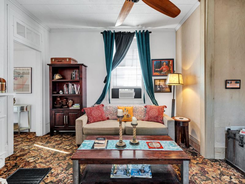 Bright, cozy living room with classic NOLA charm