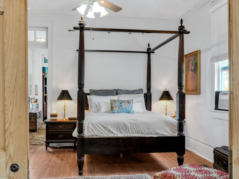 Spacious primary bedroom with elegant details