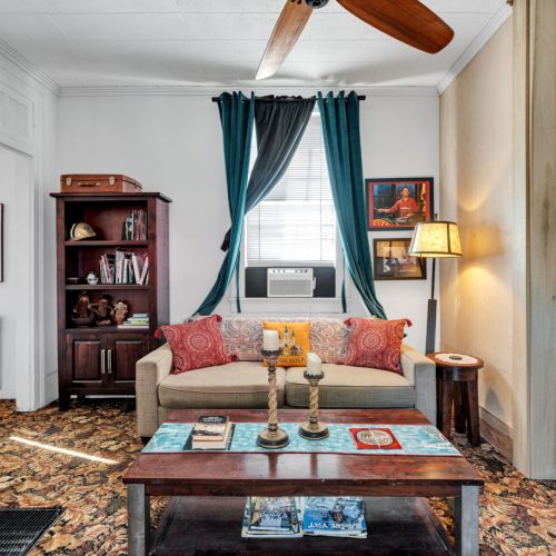 Bright, cozy living room with classic NOLA charm