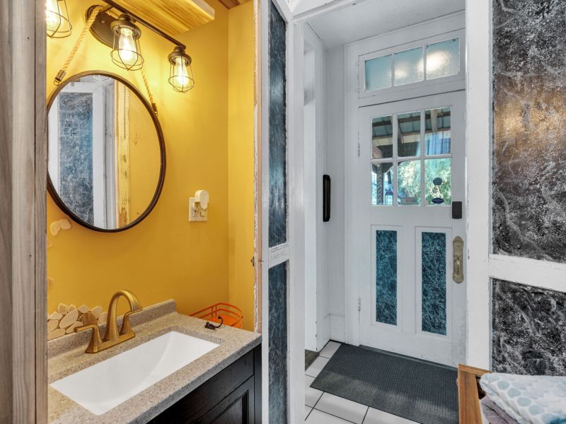 Bright bathroom with bold NOLA color