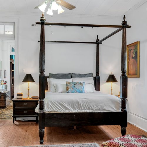 Spacious primary bedroom with elegant details