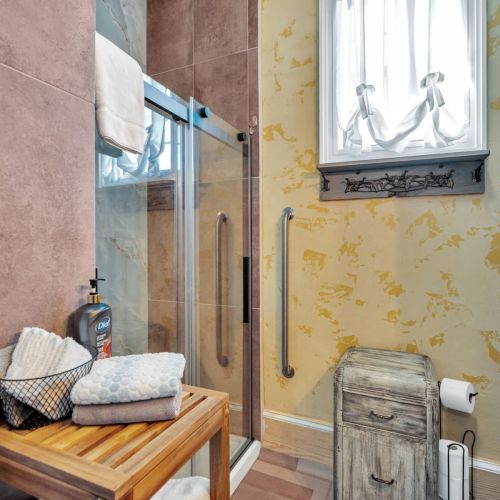 Bright walk-in shower with vintage charm